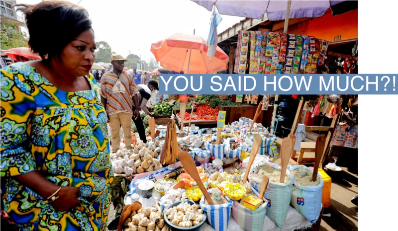 A woman shops at the Mvog Ada market in Yaounde, Cameroon