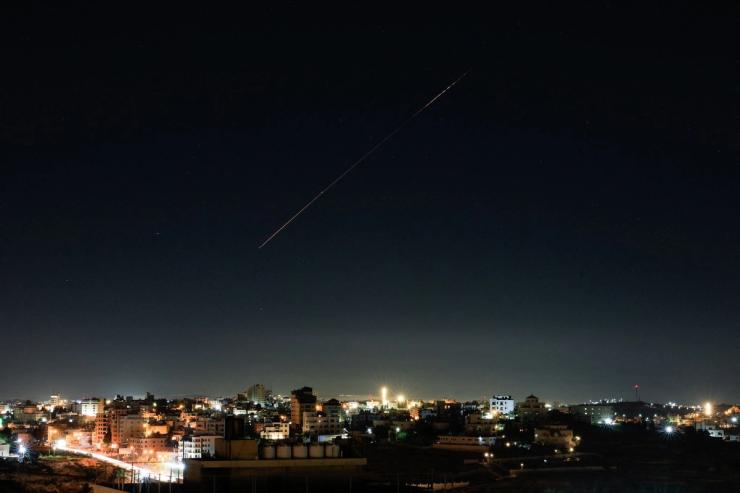 An Israeli air-defense missile flies in the sky over Israel, as seen from Hebron.