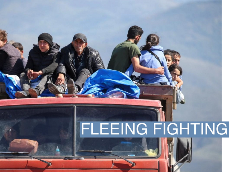 Refugees from Nagorno-Karabakh region ride in a truck upon their arrival at the border village of Kornidzor, Armenia, September 27, 2023. REUTERS/Irakli Gedenidze TPX IMAGES OF THE DAY