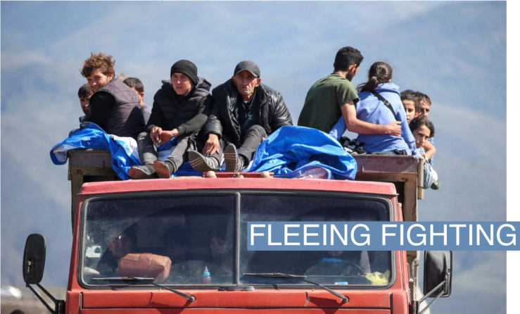 Refugees from Nagorno-Karabakh region ride in a truck upon their arrival at the border village of Kornidzor, Armenia, September 27, 2023. REUTERS/Irakli Gedenidze TPX IMAGES OF THE DAY