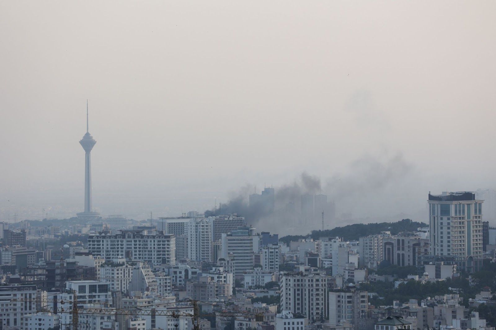 Smoke rises in Tehran. 