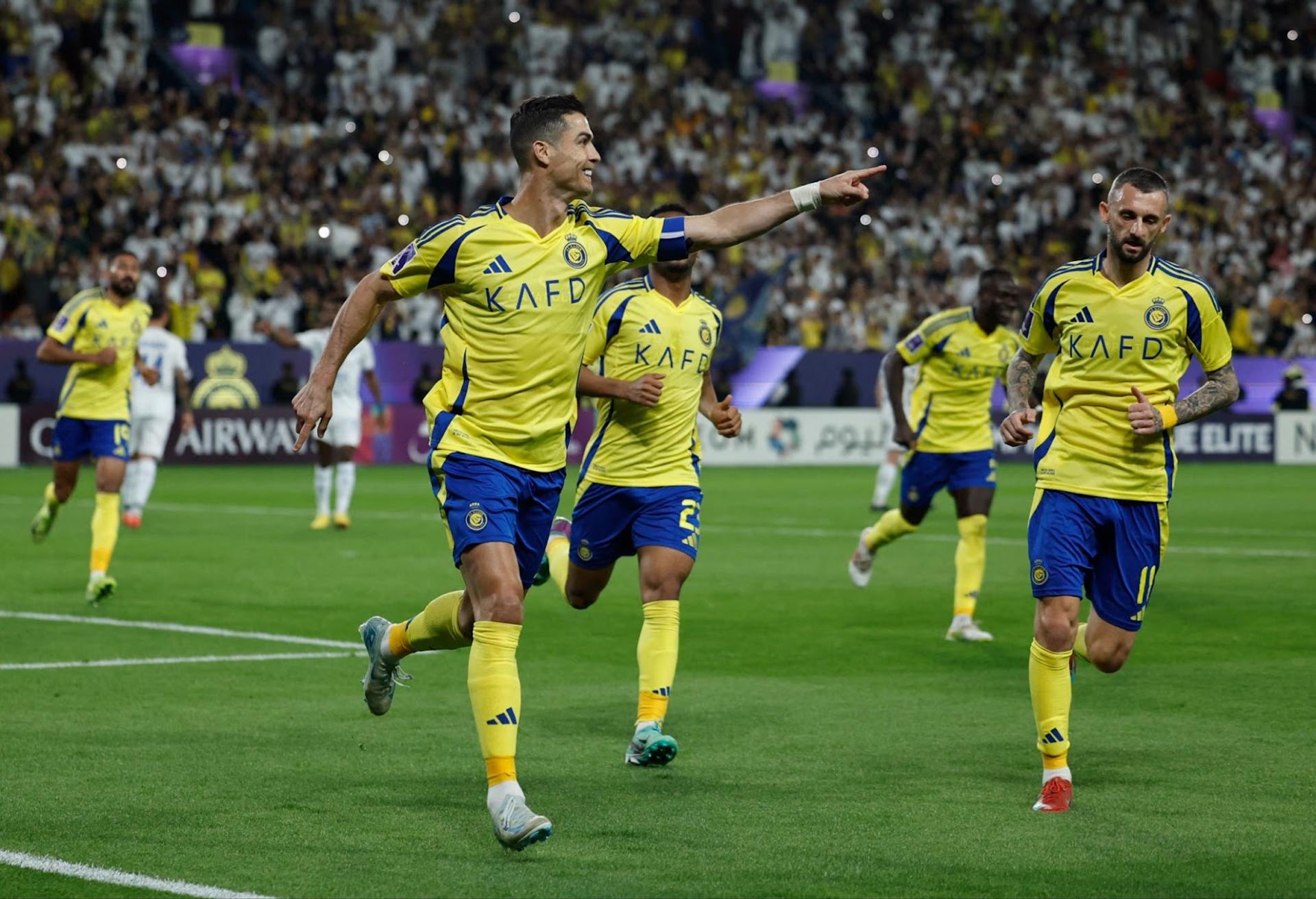 Al Nassr’s Cristiano Ronaldo celebrates scoring their second goal with teammates.