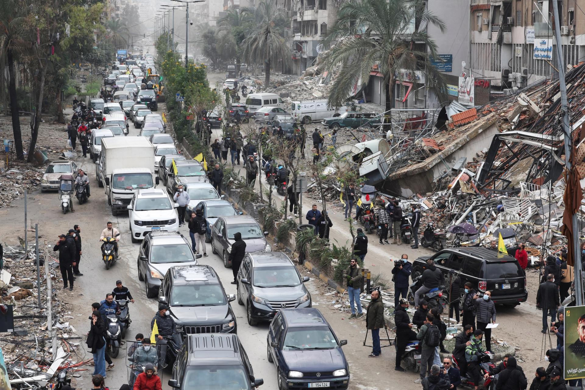 Cars drive past rubble from damaged buildings in Beirut’s southern suburbs, after a ceasefire between Israel and Iran-backed group Hezbollah took effect at 0200 GMT on Wednesday