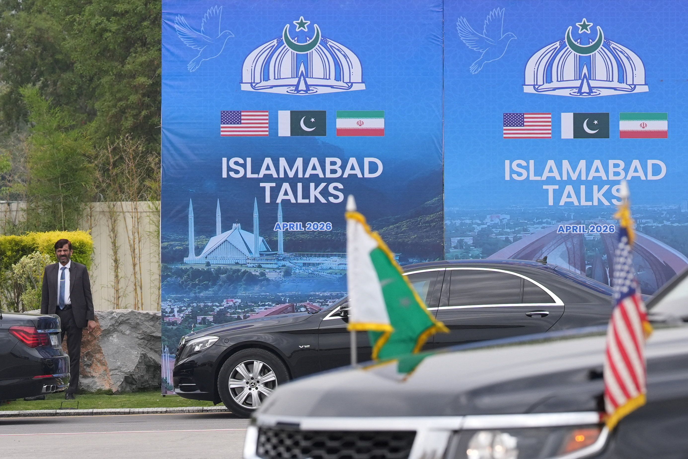 A Pakistani official stands during the arrival of the US Vice President JD Vance for talks with Iranian officials in Islamabad.