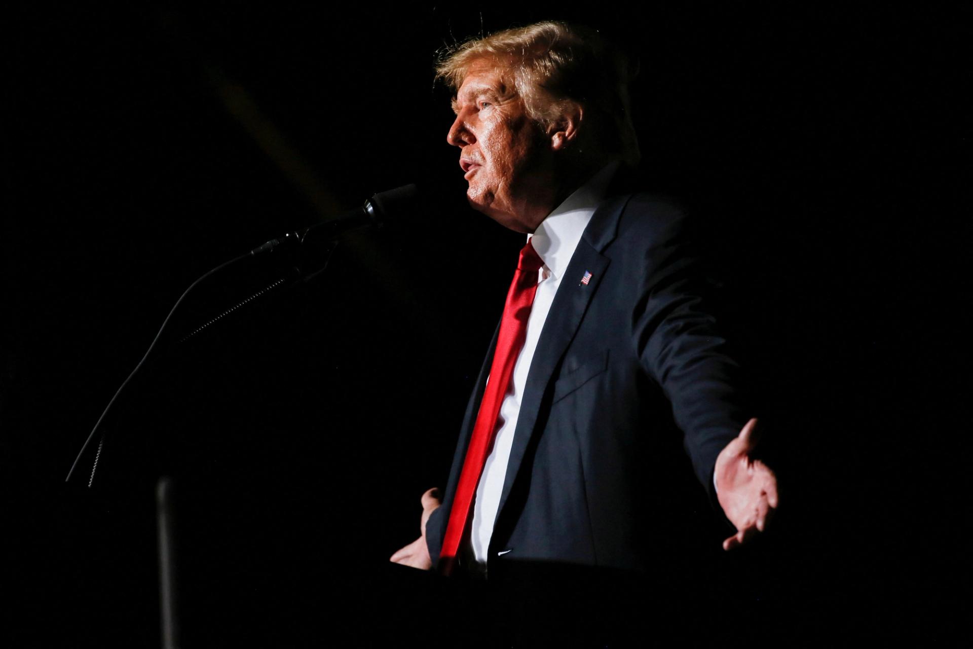 FILE PHOTO: Former U.S. President Donald Trump reacts during his speech during a rally at the Iowa States Fairgrounds in Des Moines, Iowa, U.S., October 9, 2021.