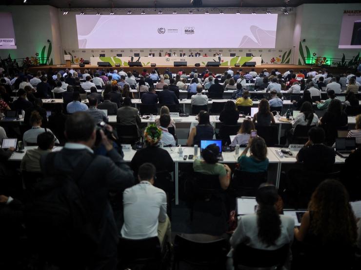 Negotiators attend a plenary session during COP30 in Belem.