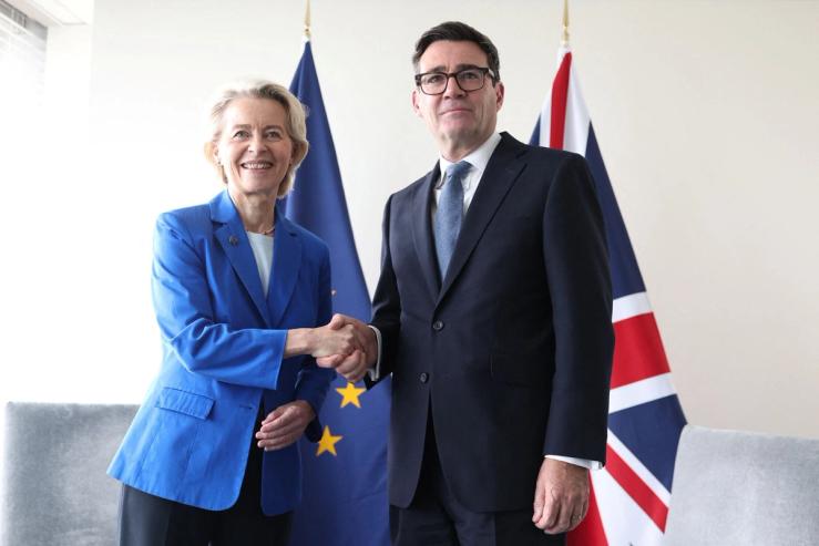 UK Prime Minister Andy Burnham shaking hands with EU Commission President Ursula von der Leyen.
