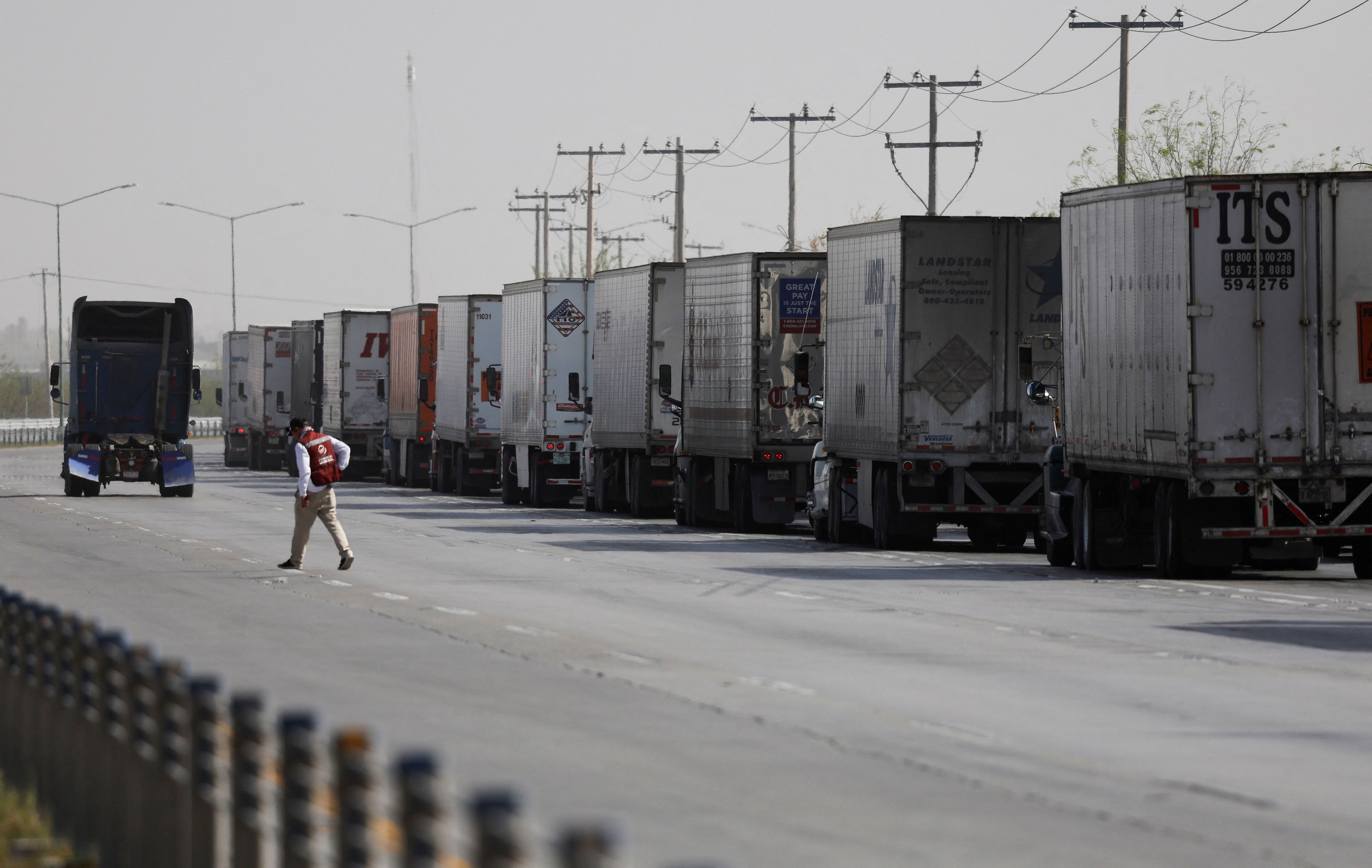 Trucks wait in a long queue for customs control at the World Trade Bridge in Nuevo Laredo 