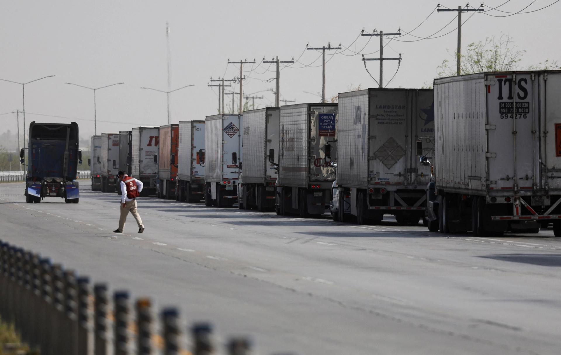 Trucks wait in a long queue for customs control at the World Trade Bridge in Nuevo Laredo 