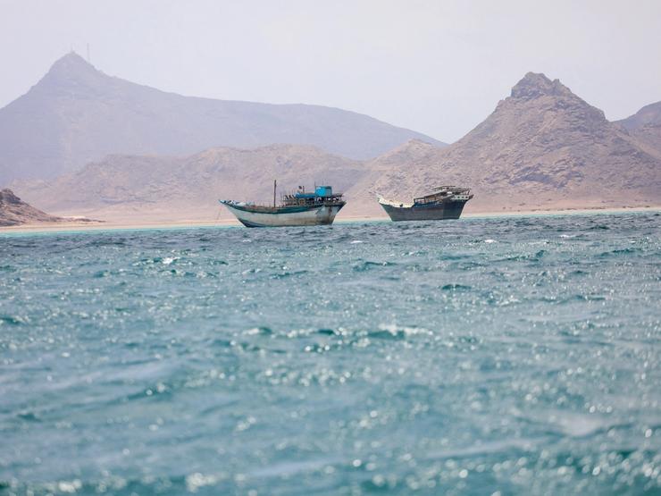 Boats float near the coast of Bab el-Mandeb, Yemen.