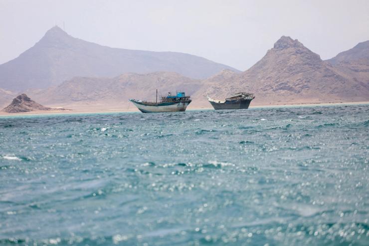 Boats float near the coast of Bab el-Mandeb, Yemen.