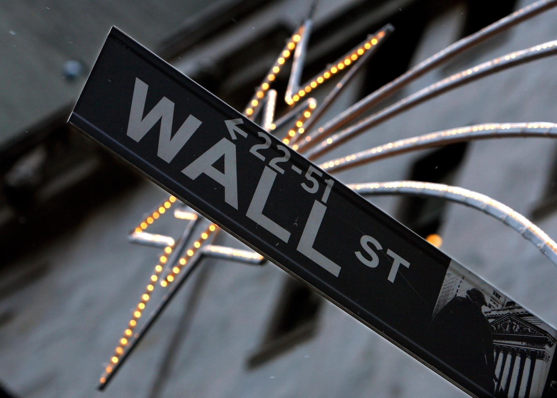 A street sign is seen on Wall Street outside the New York Stock Exchange.