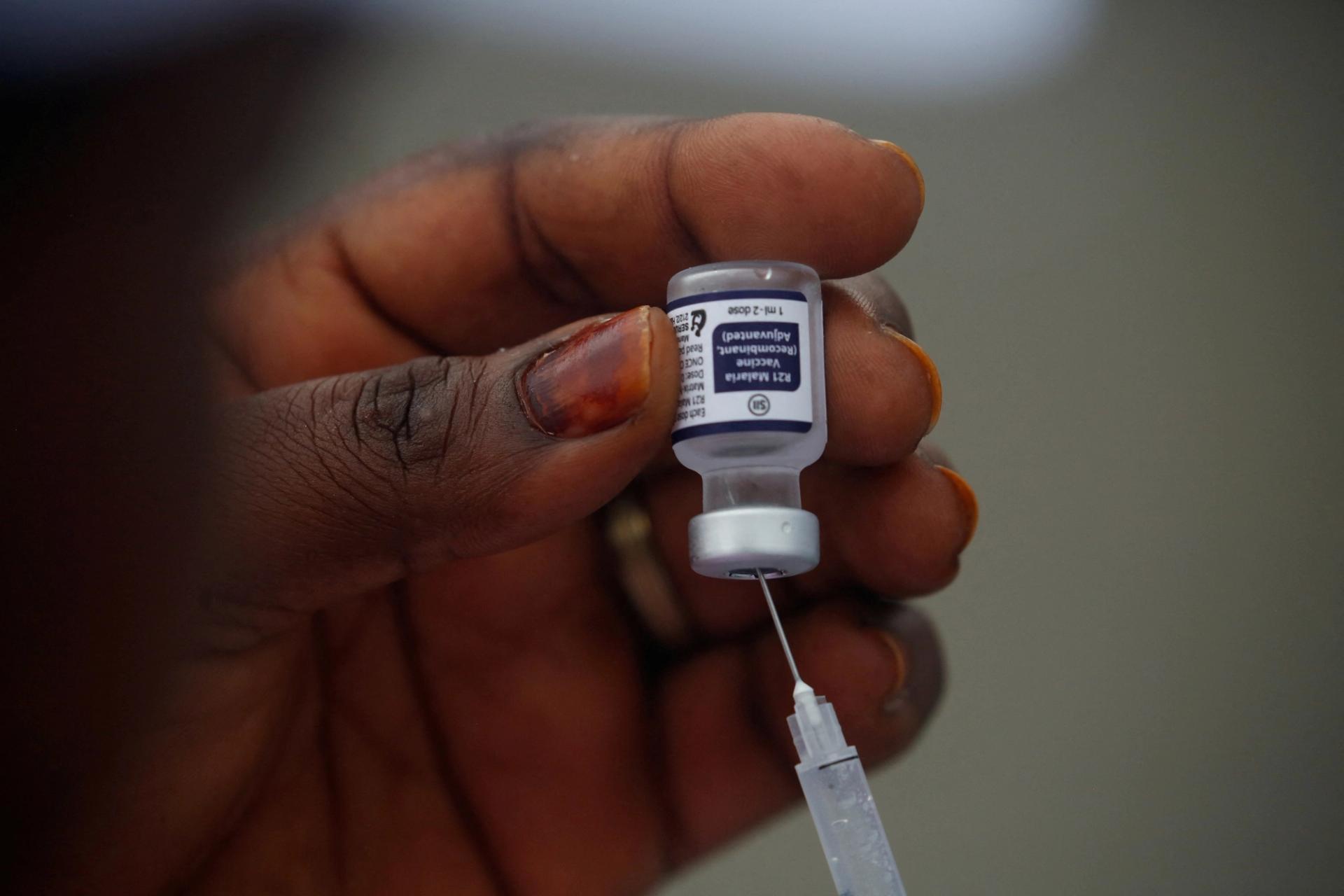 A health employee prepares the R21 malaria vaccine