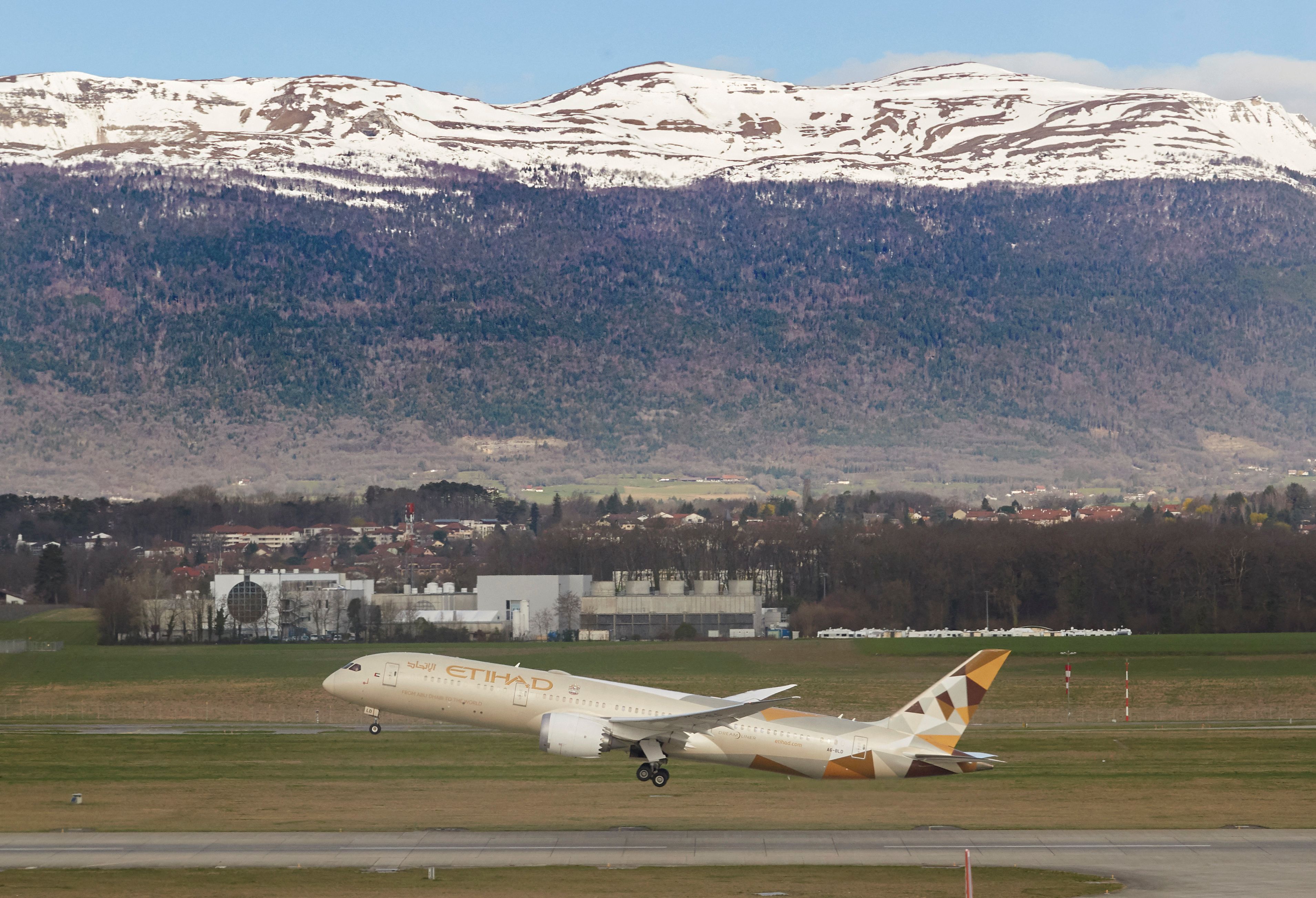 An Etihad Boeing 787-9 Dreamliner aircraft takes off at Cointrin Airport in Geneva.