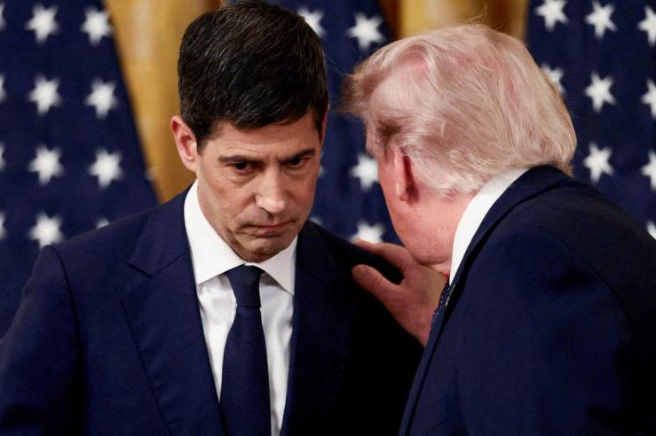 US President Donald Trump speaking to Federal Reserve Chairman Kevin Warsh.