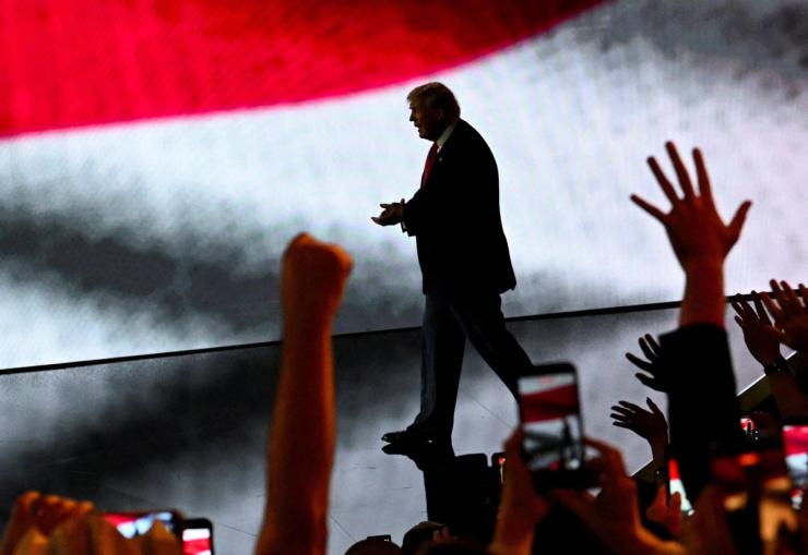 US President Donald Trump arrives on stage at the Republican National Midterm Convention.