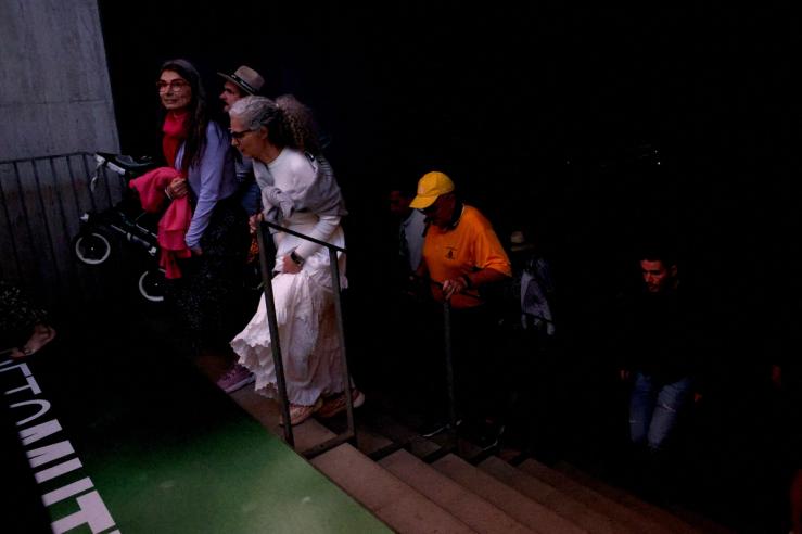 Fans leave the Madrid Open stadium in darkness.