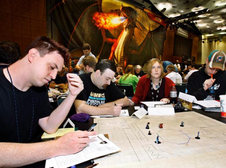 People playing Dungeons and Dragons.