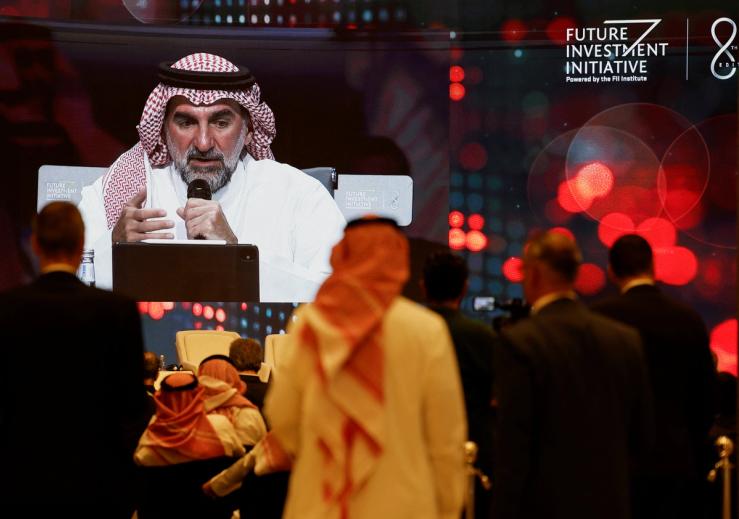 Delegates watch as Governor of Public Investment Fund of Saudi Arabia Yasir Al-Rumayyan attends the Future Investment Initiative (FII) in Riyadh, Saudi Arabia October