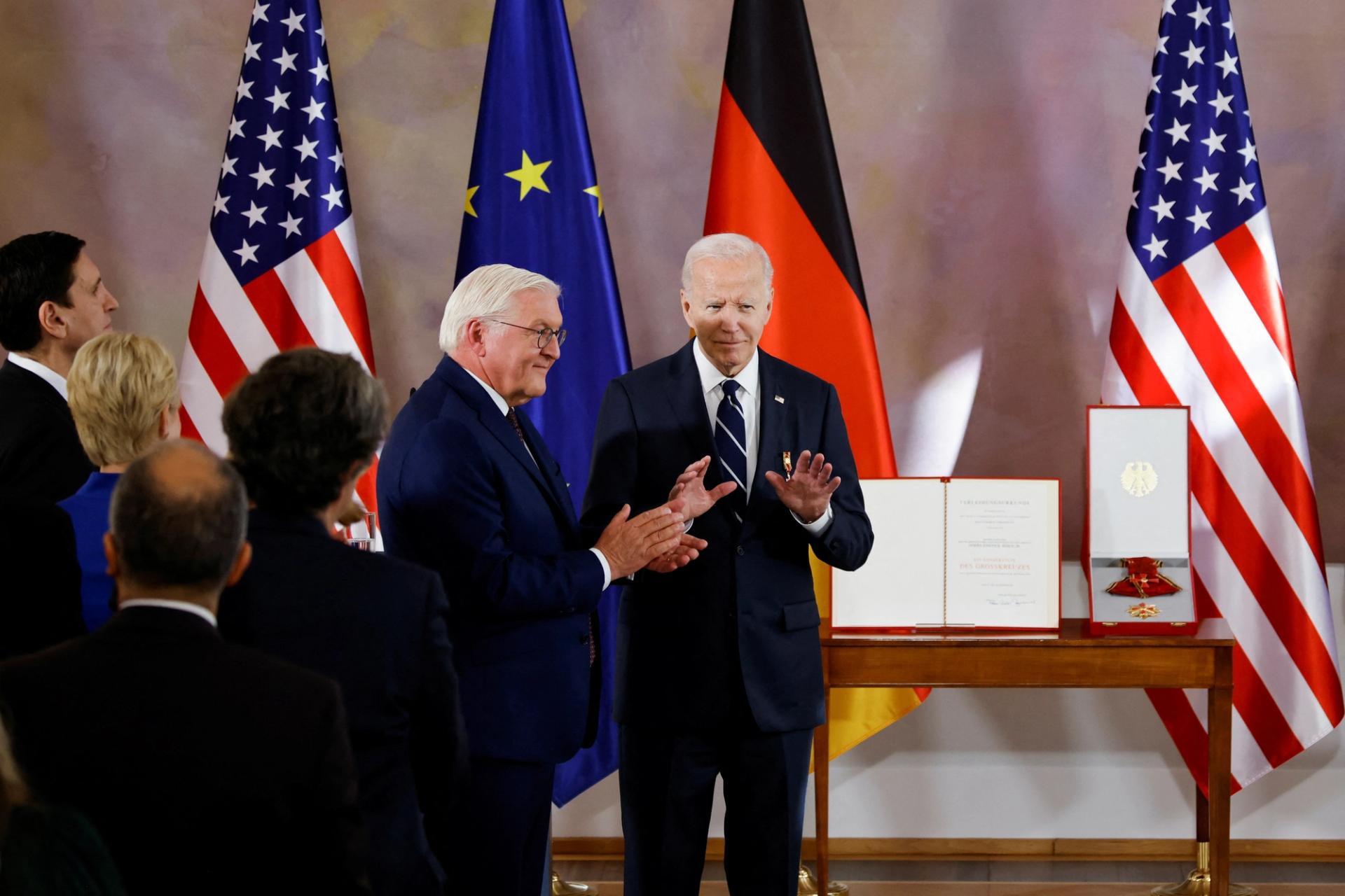 US President Joe Biden stands with German President Frank-Walter Steinmeier, during ceremony to award him with Germany’s highest honour, the Grand Cross of the Order of Merit 