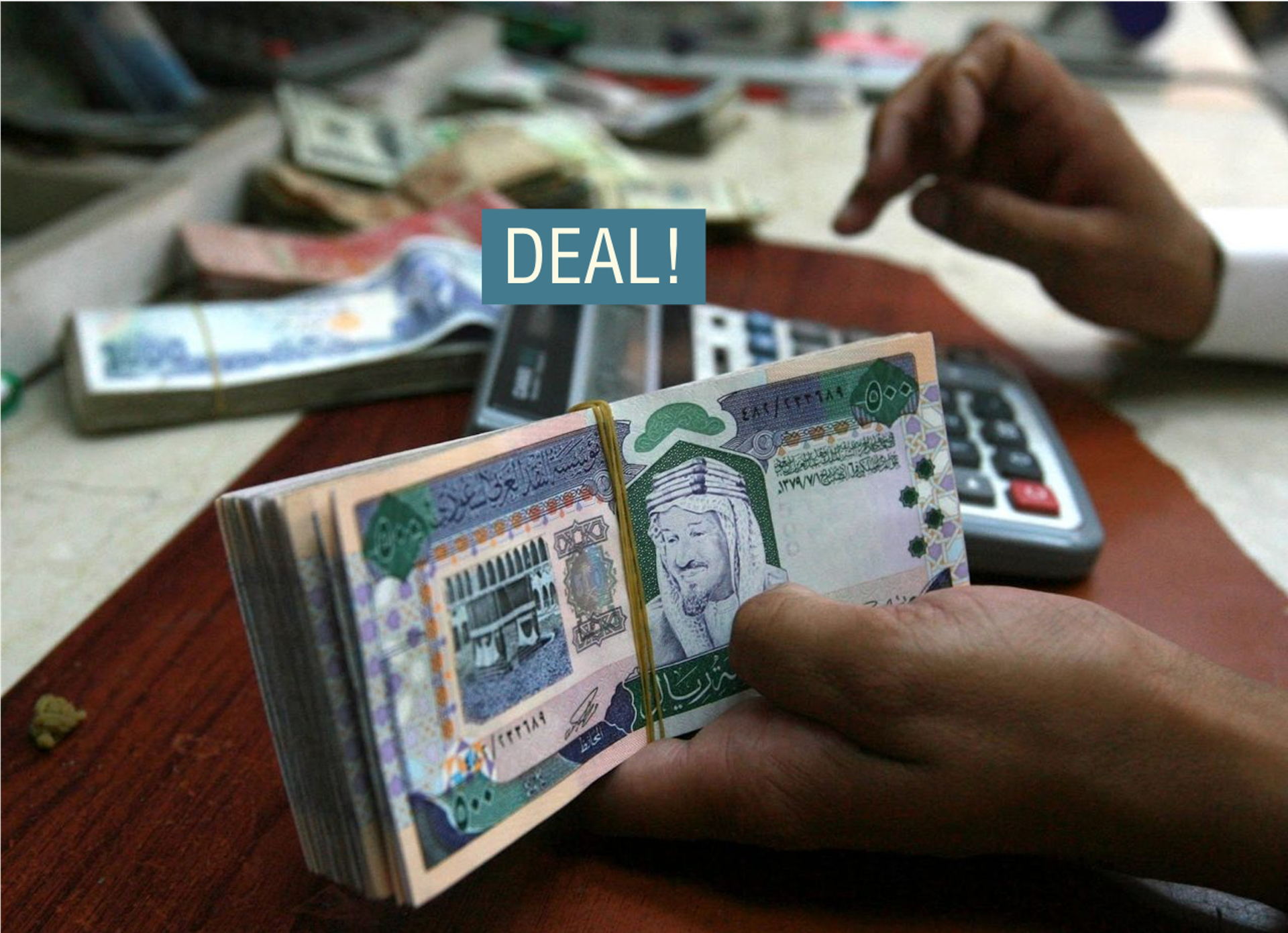 A Saudi money exchanger counts Saudi riyals in Riyadh.