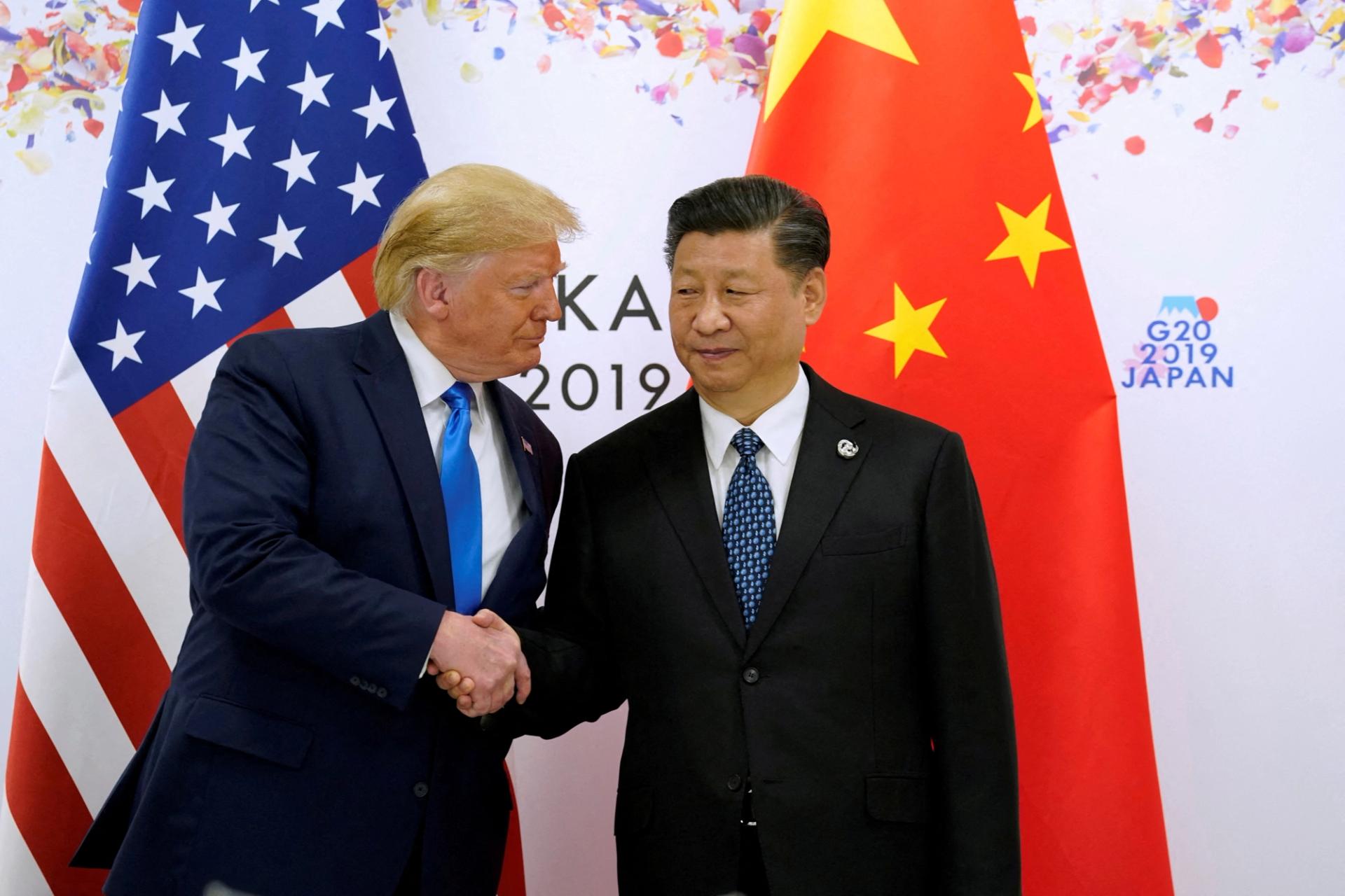 Then-U.S. President Donald Trump and China’s President Xi Jinping shake hands ahead of their bilateral meeting during the G20 leaders summit in Osaka, Japan.