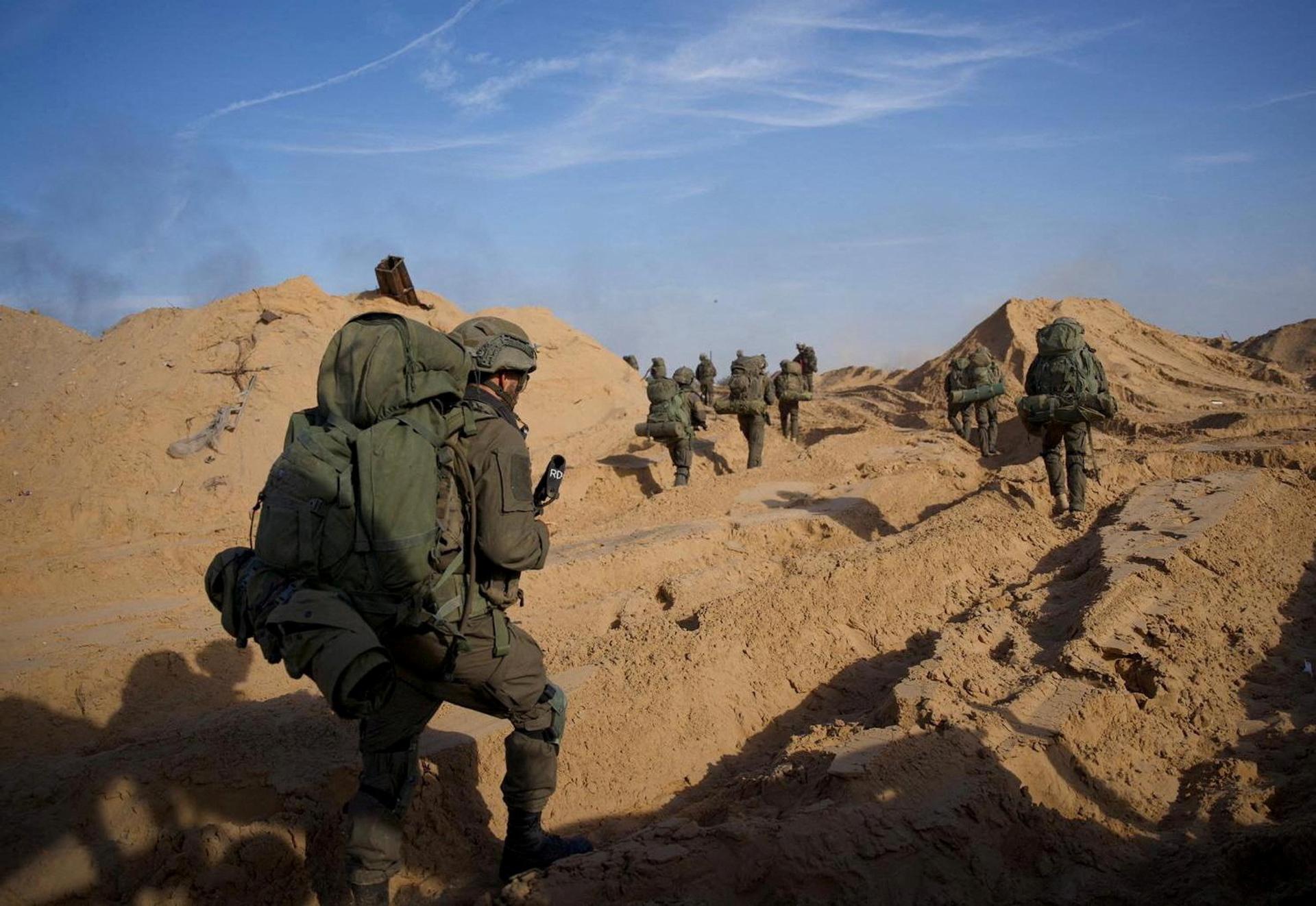 Israeli soldiers take part in an operation against Palestinian Islamist group Hamas, in a location given as Gaza.