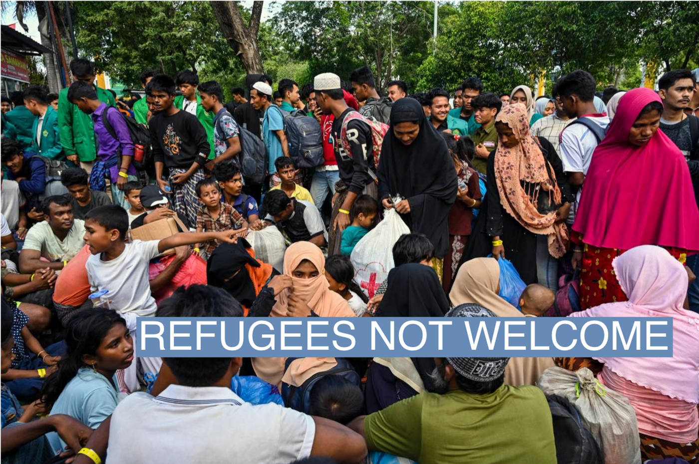 Rohingya refugees gather in front of a government building after demonstrating university students forced them to relocate from a previous government facility, in Banda Aceh on December 27, 2023. 