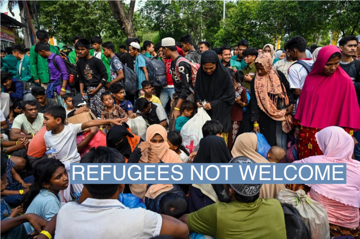 Rohingya refugees gather in front of a government building after demonstrating university students forced them to relocate from a previous government facility, in Banda Aceh on December 27, 2023.