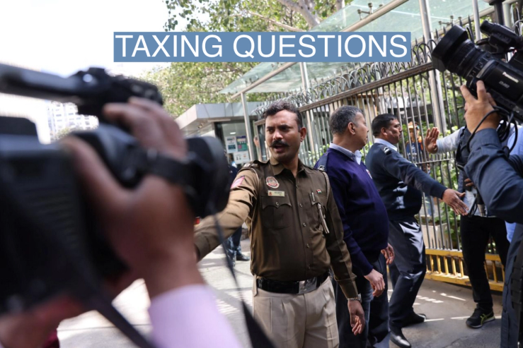 Police officers stand outside a building having BBC offices, where income tax officials are conducting a search, in New Delhi, India, February 14, 2023.