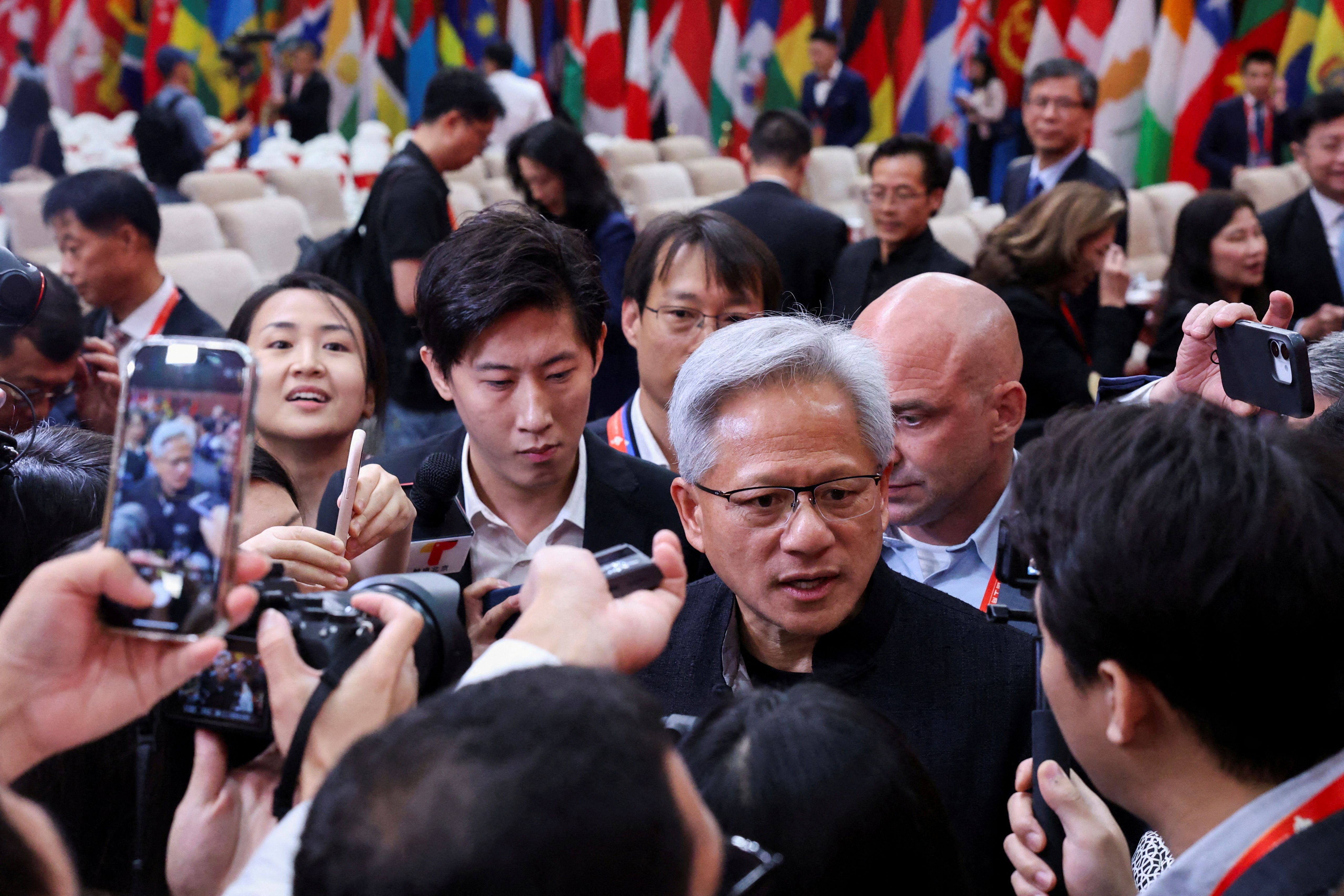 Nvidia CEO Jensen Huang speaks to media members after the opening ceremony for the China International Supply Chain Expo in Beijing.