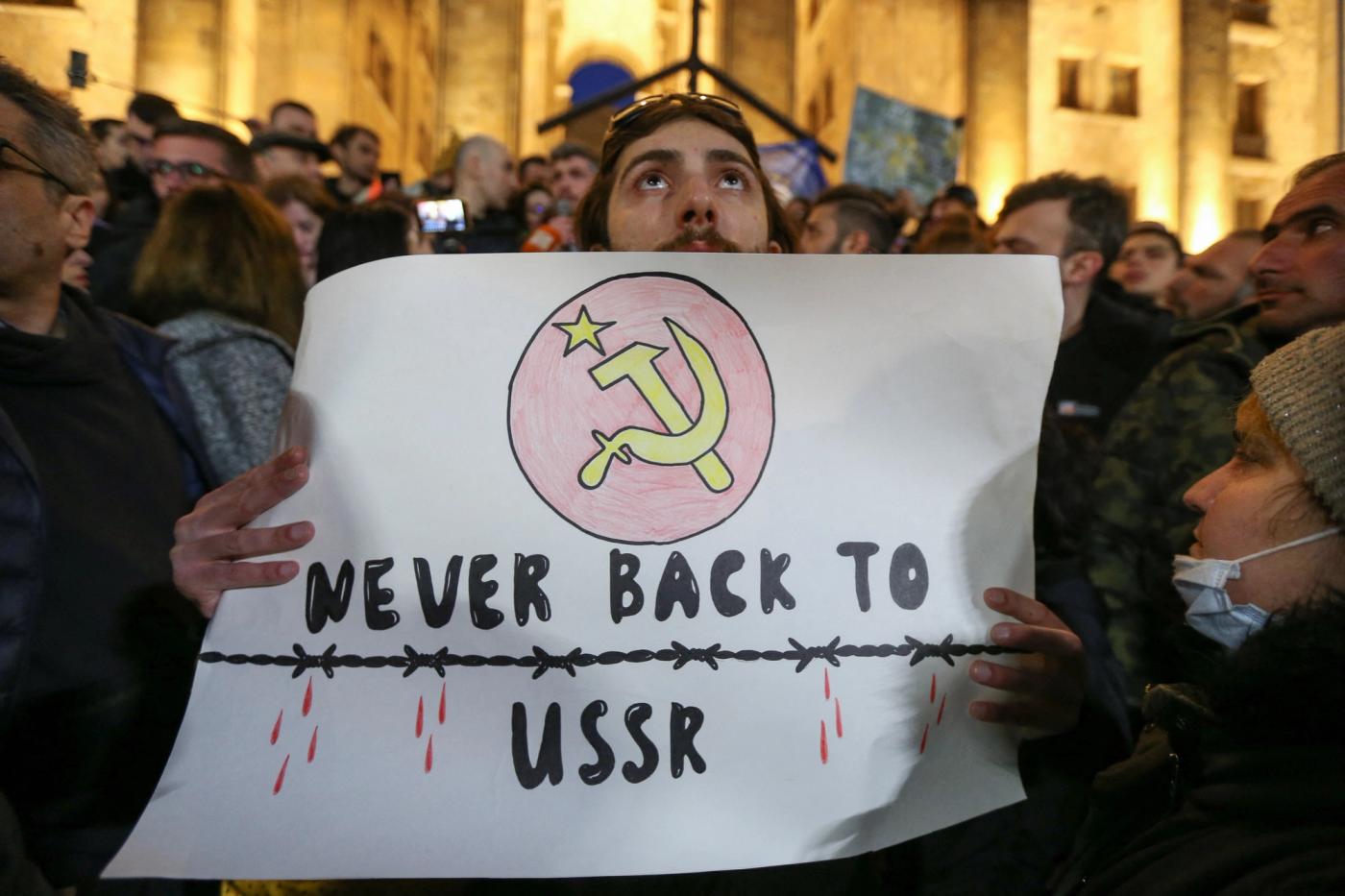 Participants protest against a draft law on "foreign agents", which critics say represents an authoritarian shift and could hurt Georgia's bid to join the European Union, during a rally outside the parliament building in Tbilisi, Georgia, March 8, 2023.