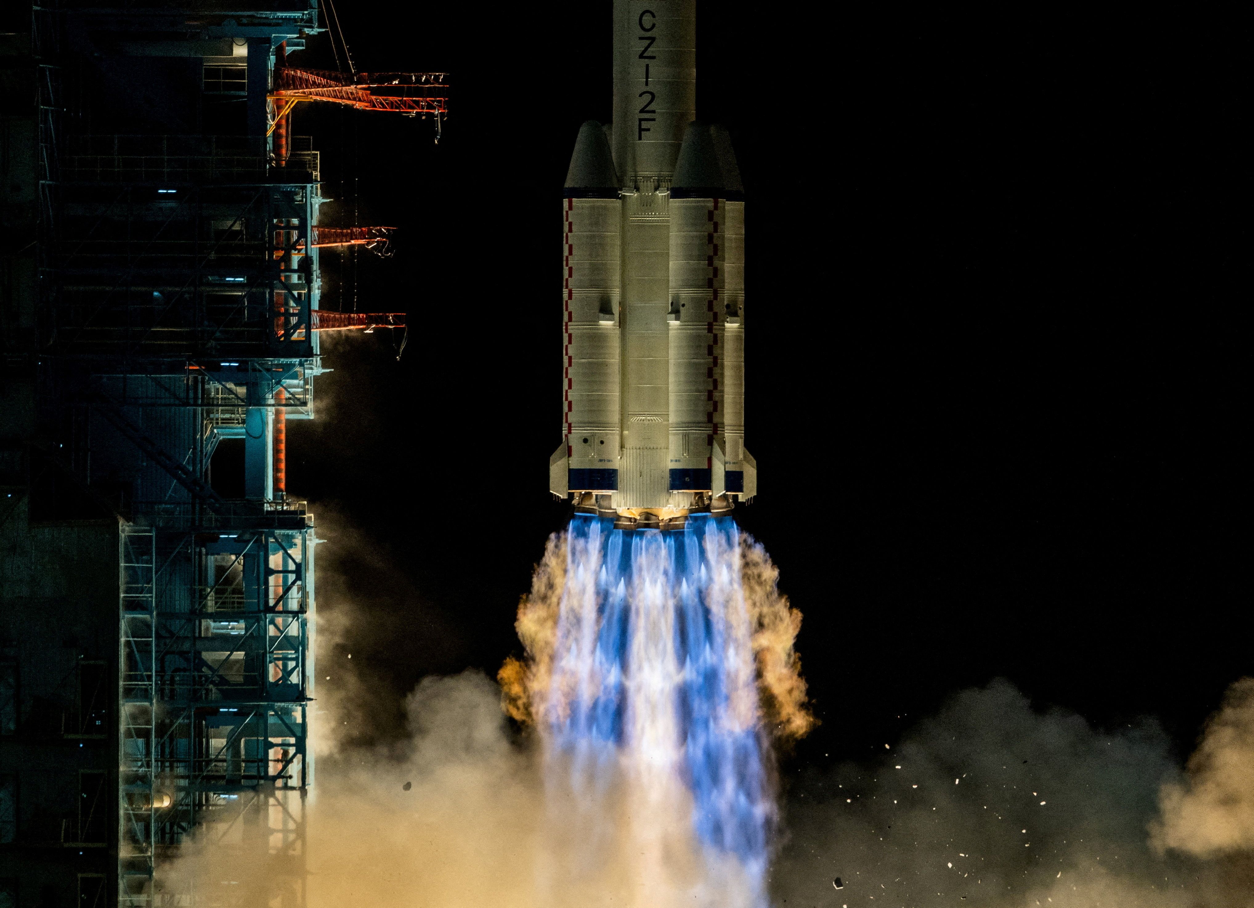 A Long March 2F rocket carrying the Shenzhou-21 spacecraft with astronauts Zhang Hongzhang, Zhang Lu, and Wu Fei blasts off to China’s Tiangong space station from the launchpad at the Jiuquan Satellite Launch Center, near Jiuquan