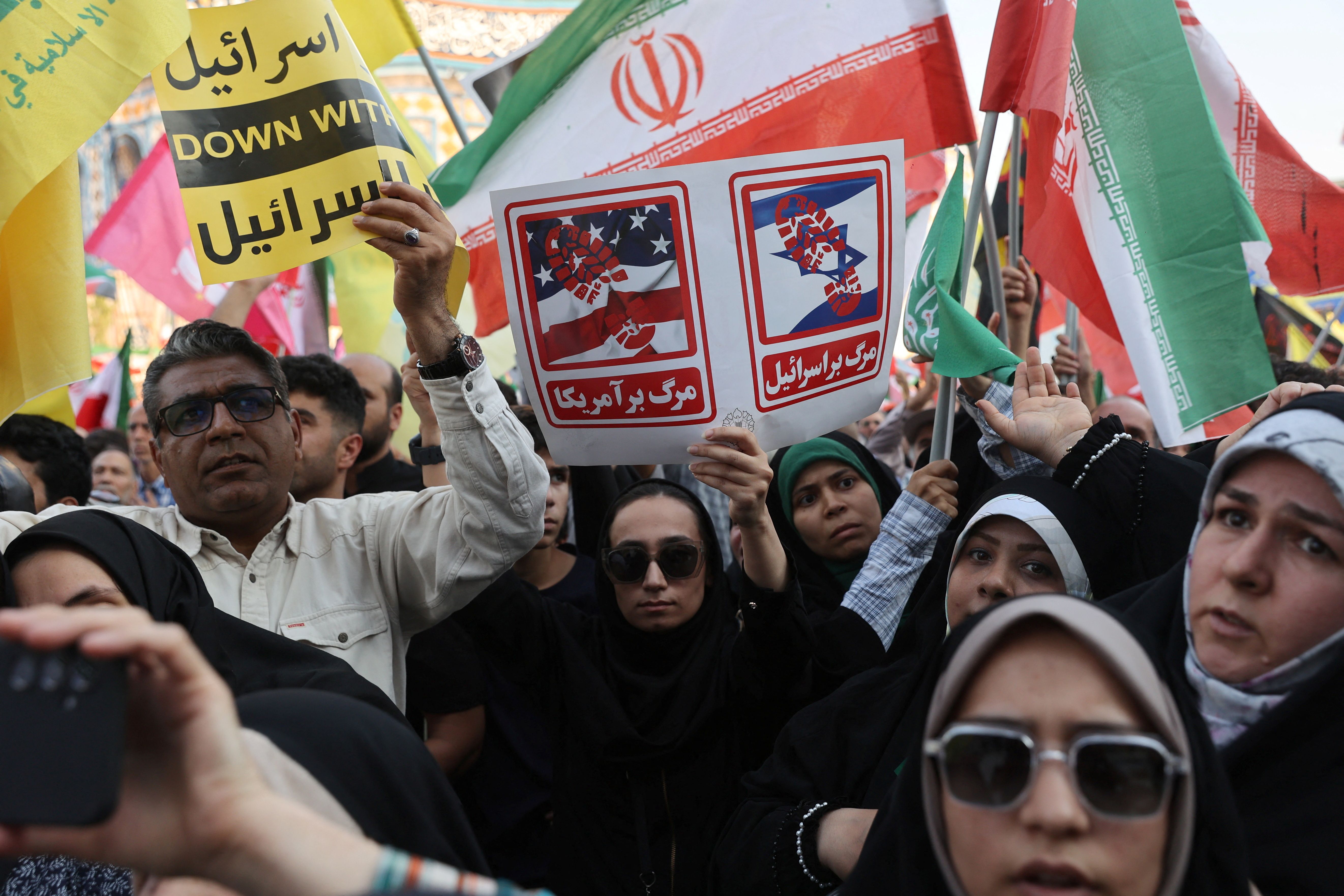 People attend an anti-Israeli rally following the Israeli strikes on Iran.