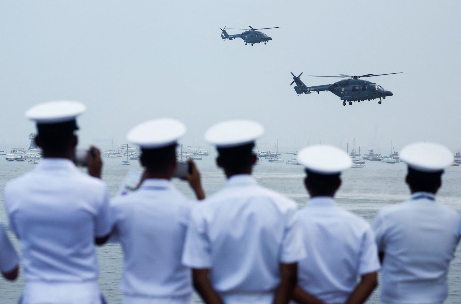 Indian Navy personnel watch a demonstration during Navy Day celebrations in Mumbai.