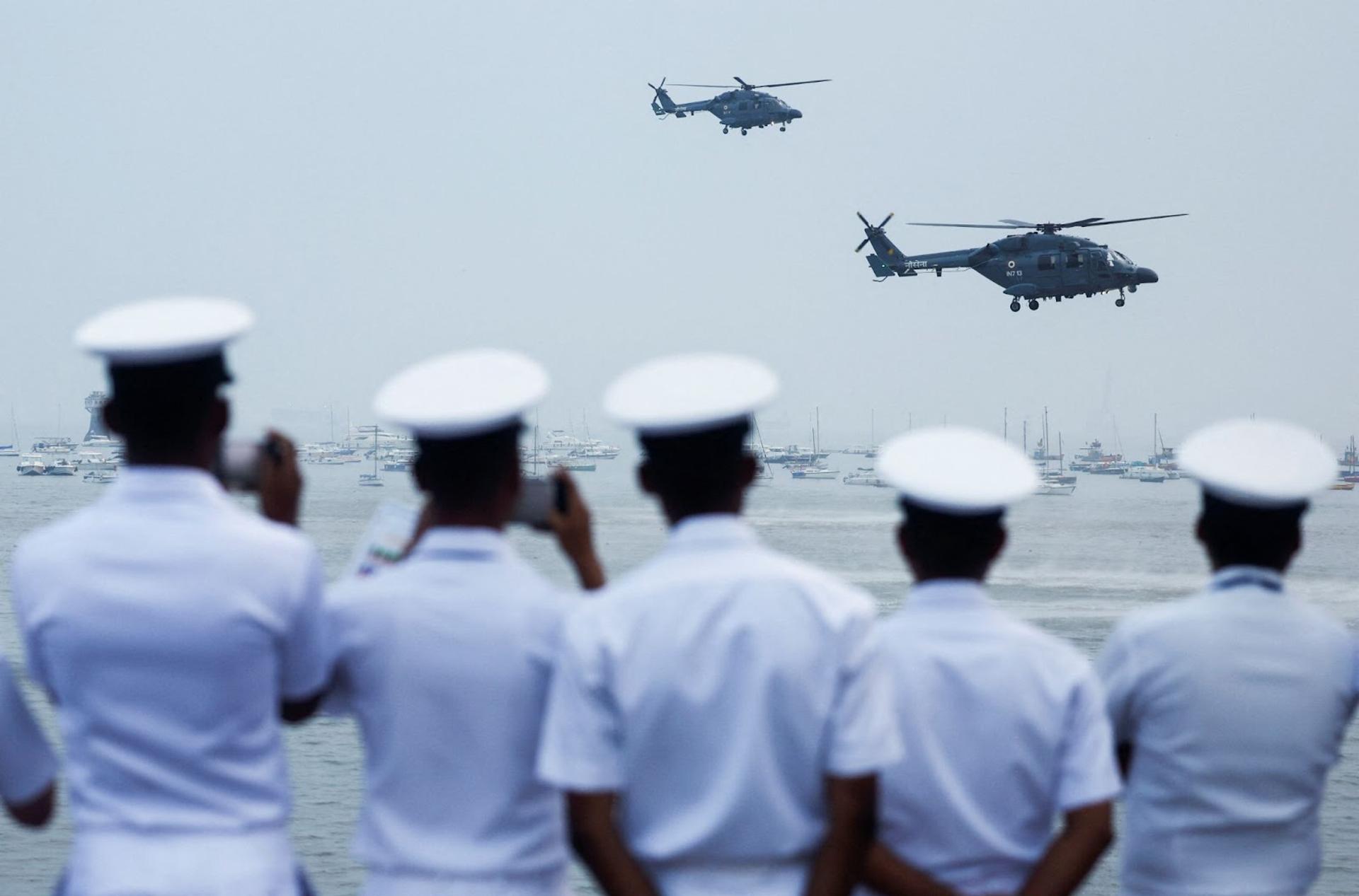 Indian Navy personnel watch a demonstration during Navy Day celebrations in Mumbai.