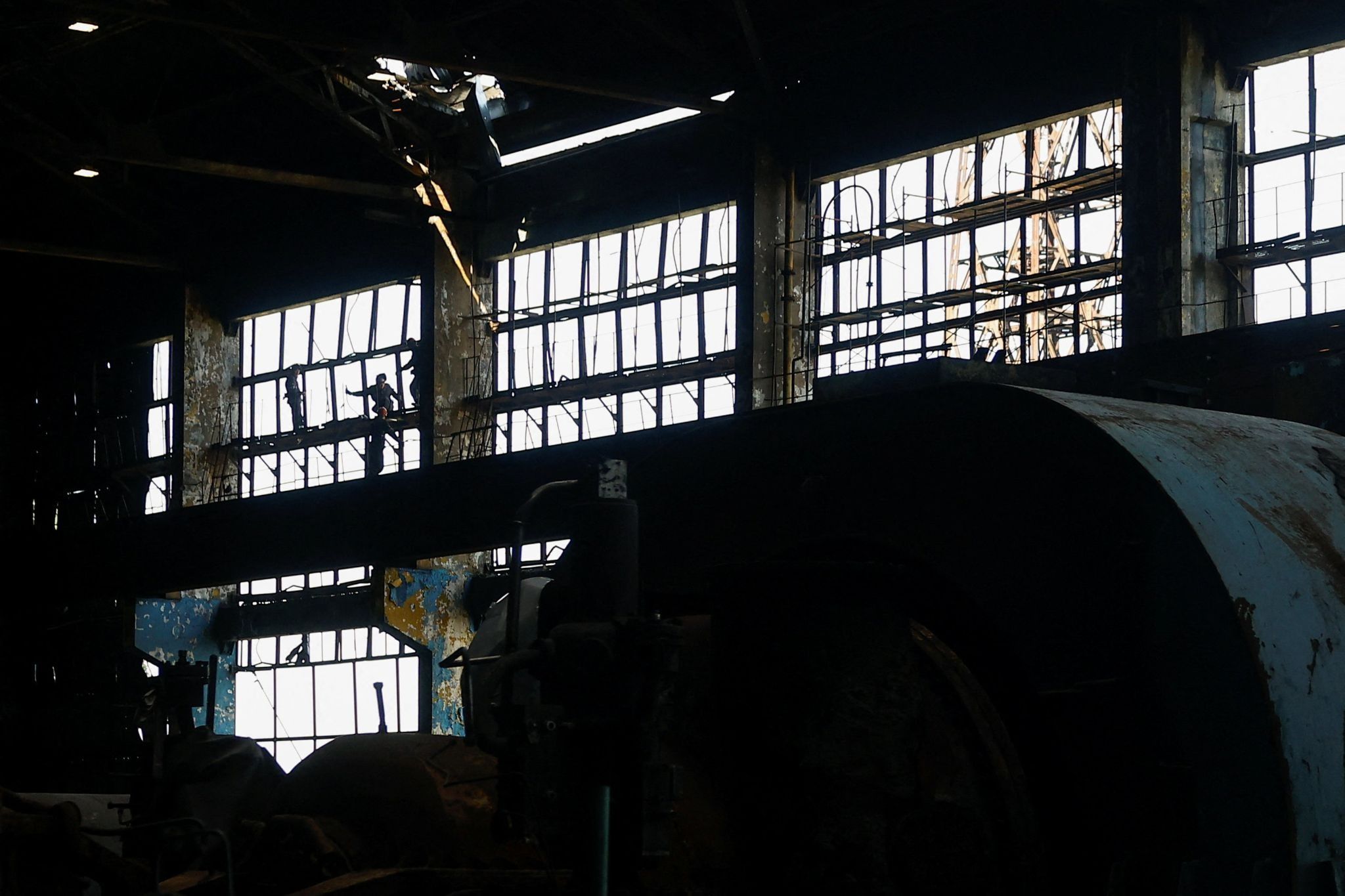 Employees work at a thermal power plant damaged multiple times during Russian missile and drone strikes. 