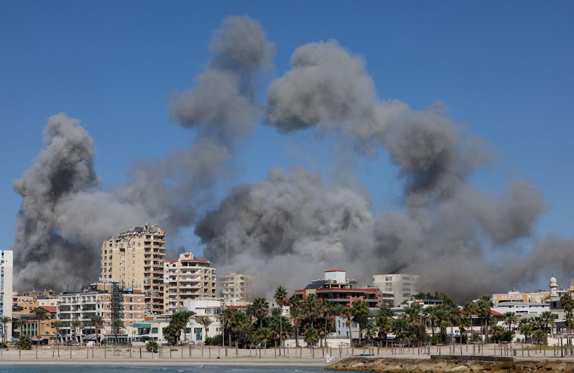 Smoke billows over the UNESCO-listed port city of Tyre after Israeli strikes.