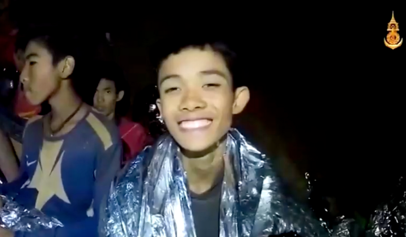 Duangpetch Promthep smiling in a flooded cave in Chiang Rai in 2018 