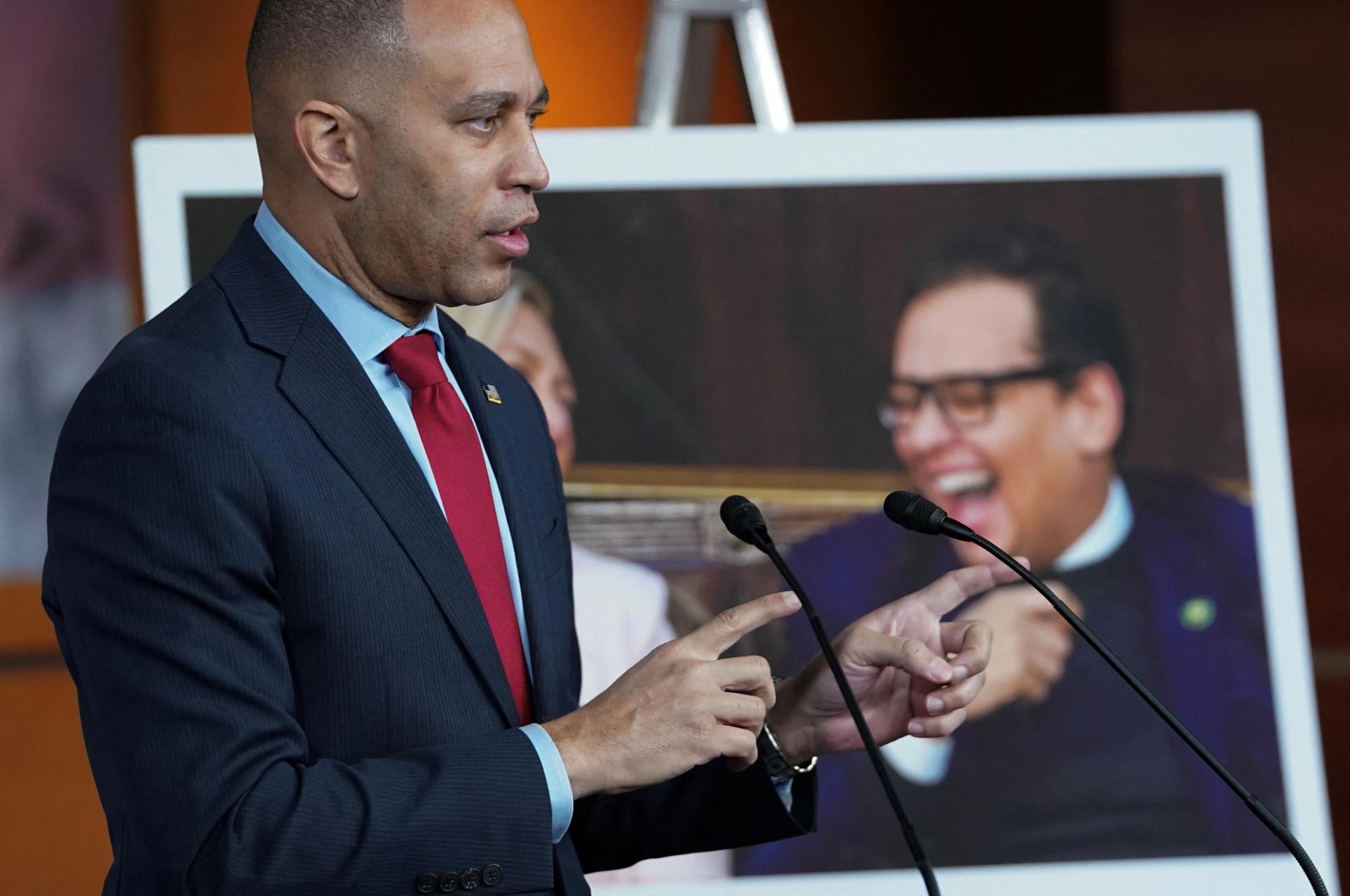 A photo of embattled U.S. Rep. George Santos is displayed as House of Representatives Democratic leader Hakeem Jeffries speaks during a press conference at the Capitol in Washington, U.S., November 30, 2023.
