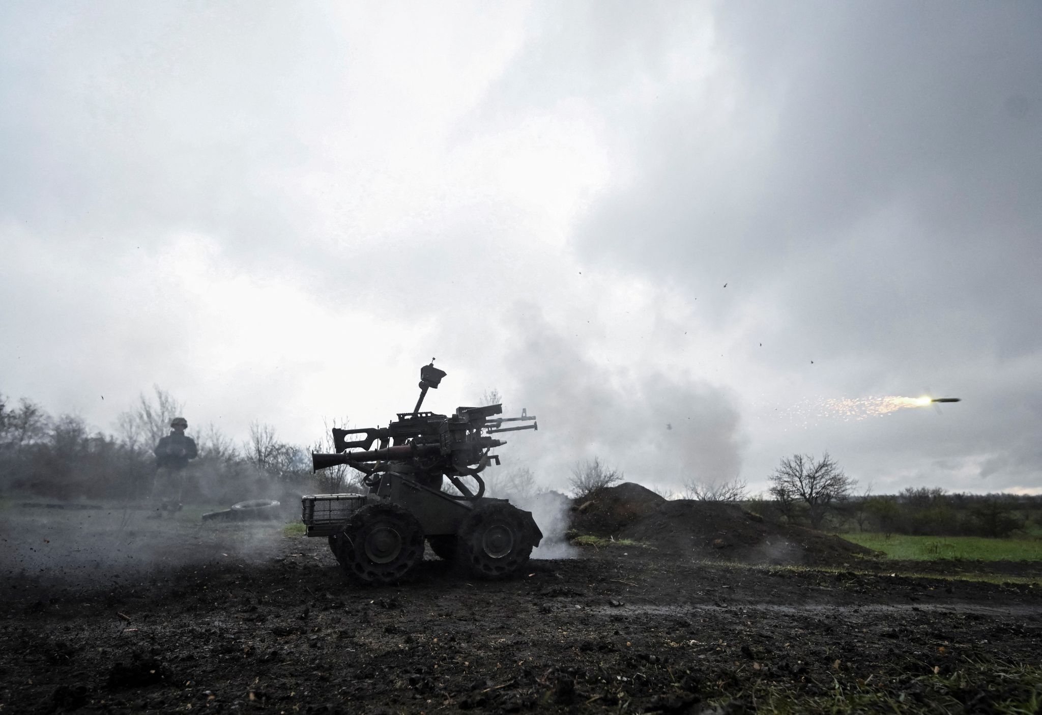 A member of the 65th Separate Mechanized Brigade of the Armed Forces of Ukraine fires a RPG-7 grenade launcher which is mounted on an unmanned ground vehicle during a training, amid Russia’s attack on Ukraine, in Zaporizhzhia region