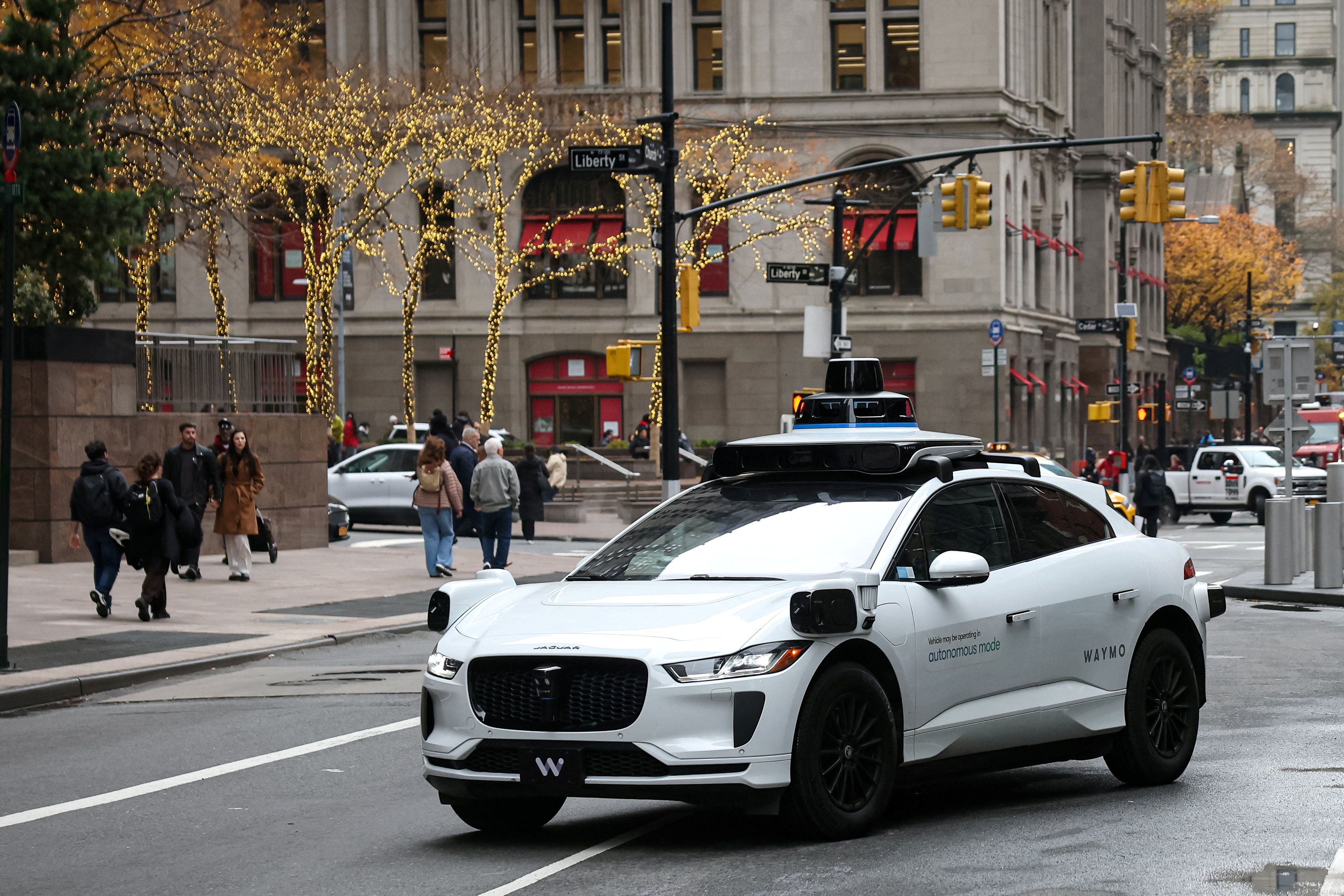 Waymo driverless taxi drives in lower Manhattan in New York.