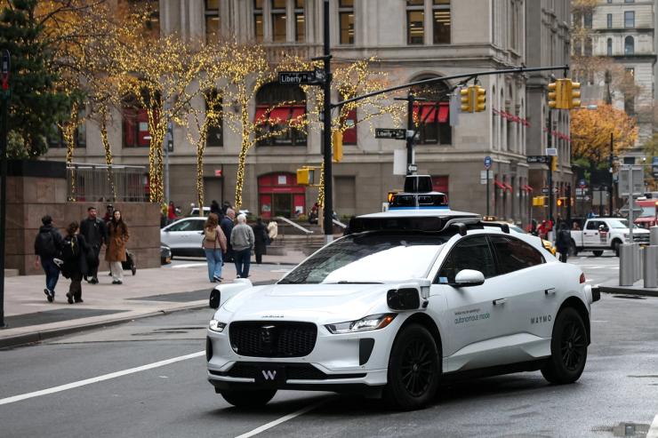 Waymo driverless taxi drives in lower Manhattan in New York.