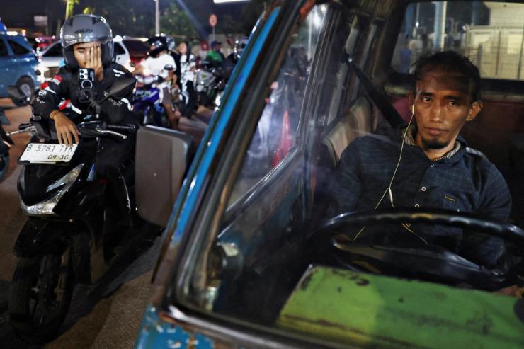 Vehicles queue up for gasoline at a PTT gas station amid the U.S.-Israel conflict with Iran, on the outskirts of Bangkok