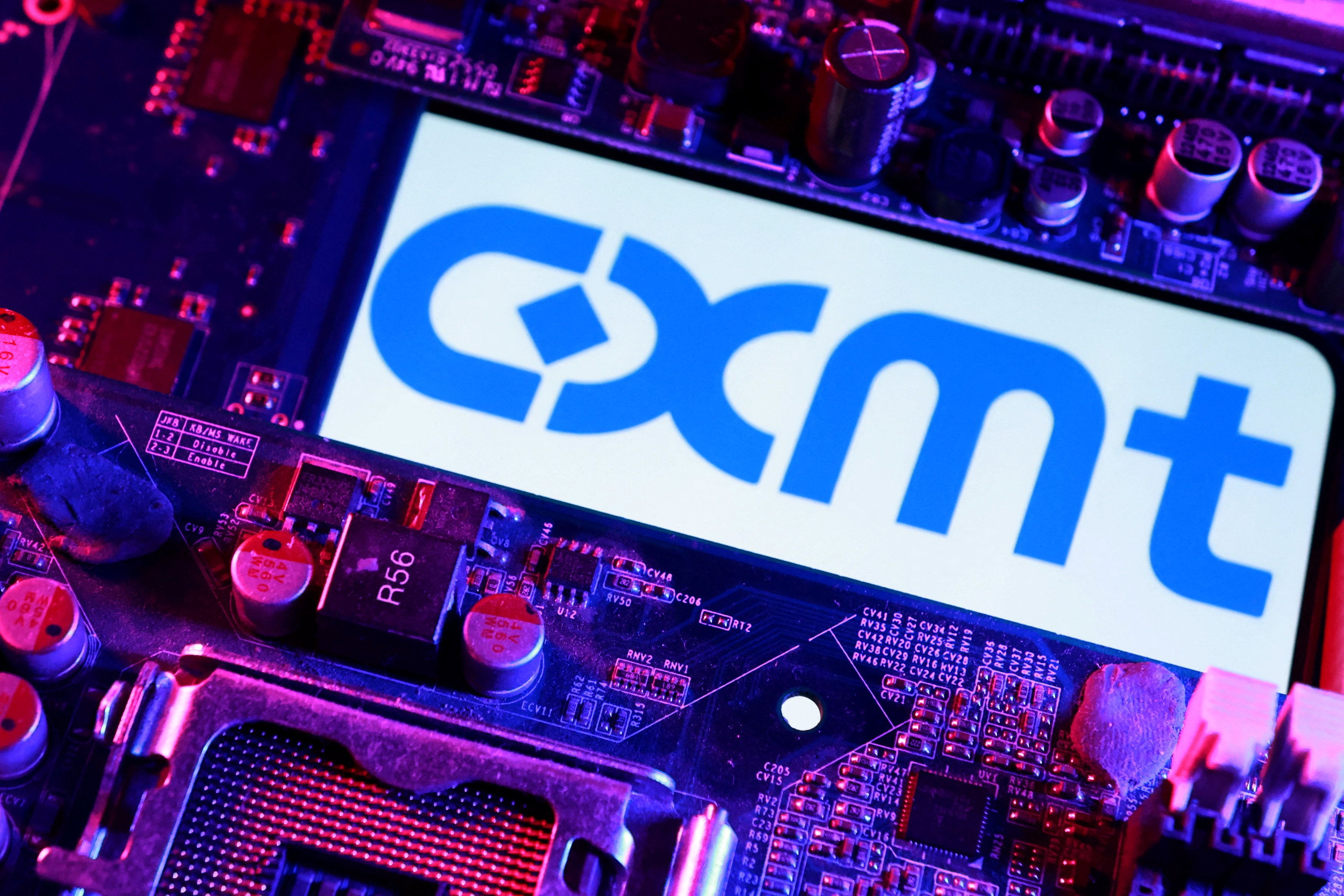 CXMT logo and computer motherboard are seen in this illustration.