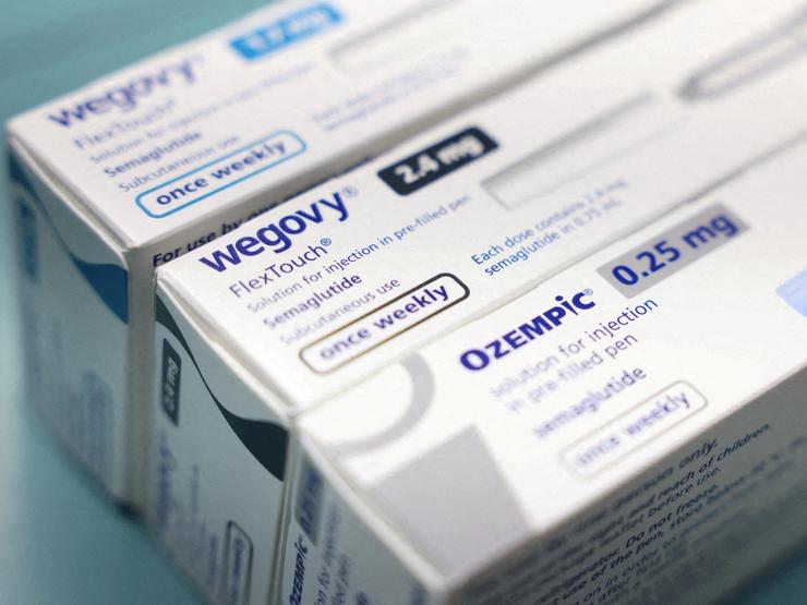 Boxes of Ozempic and Wegovy made by Novo Nordisk are seen at a pharmacy in London.