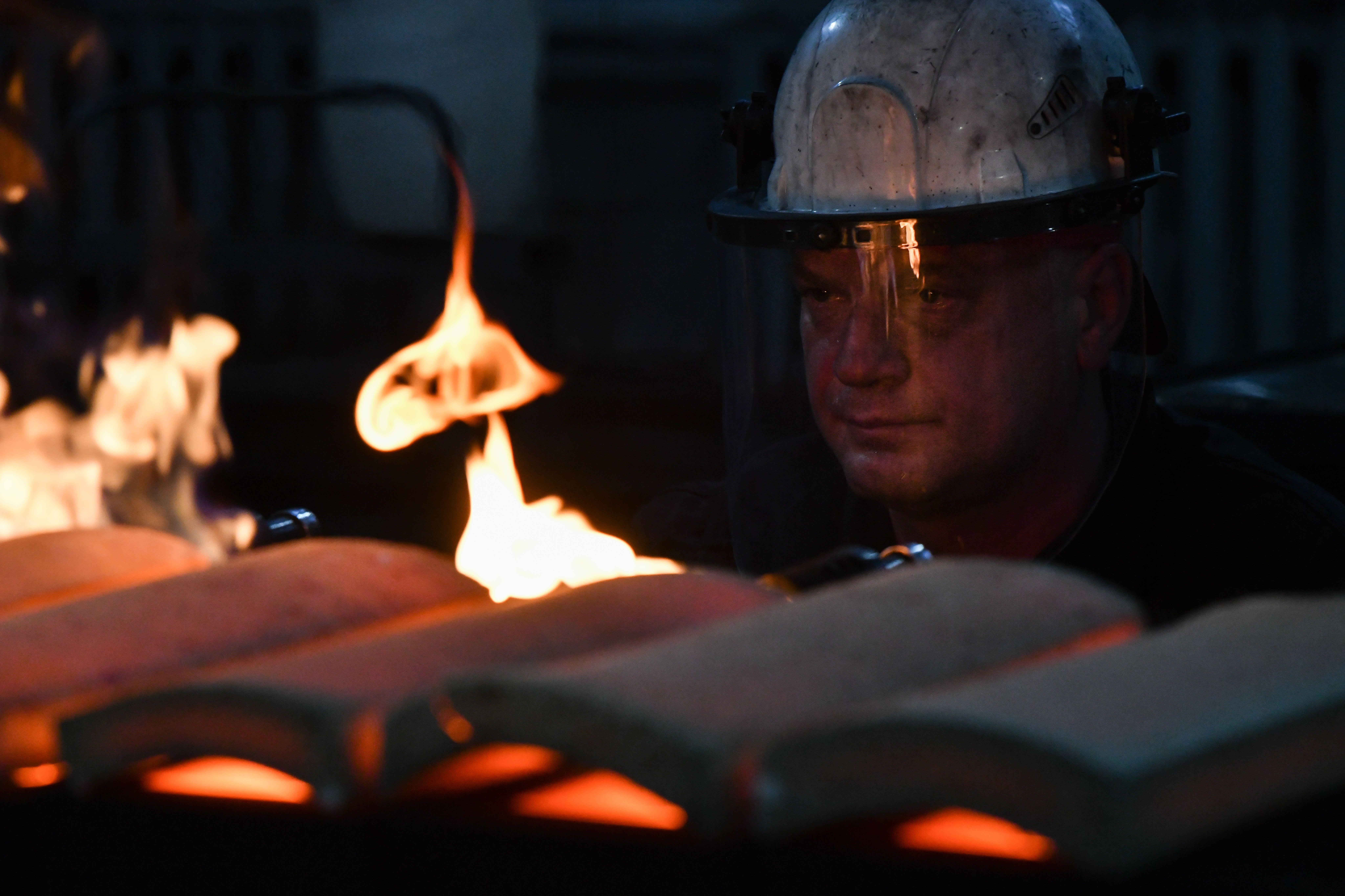 A worker casts ingots of 99.99 percent pure gold at Novosibirsk Refining Plant, Russia’s leading gold refining and bar manufacturing plant, in Novosibirsk, Russia