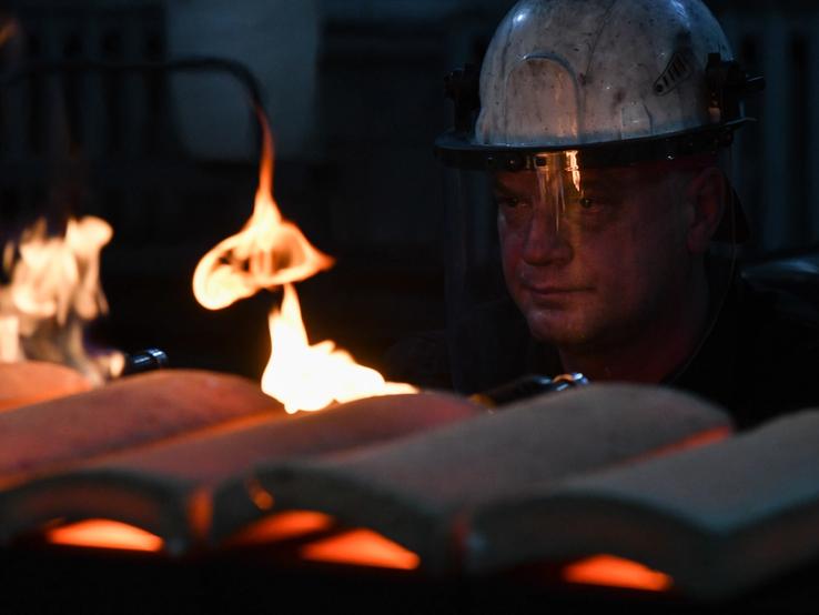 A worker casts ingots of 99.99 percent pure gold at Novosibirsk Refining Plant, Russia’s leading gold refining and bar manufacturing plant, in Novosibirsk, Russia