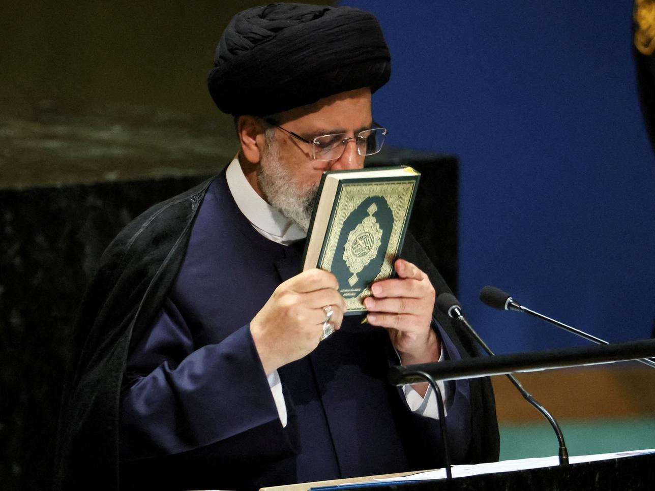 FILE PHOTO: Iran's President Ebrahim Raisi kisses the holy Koran as he addresses the 78th Session of the U.N. General Assembly in New York City, U.S., September 19, 2023. REUTERS/Brendan McDermid/File Photo