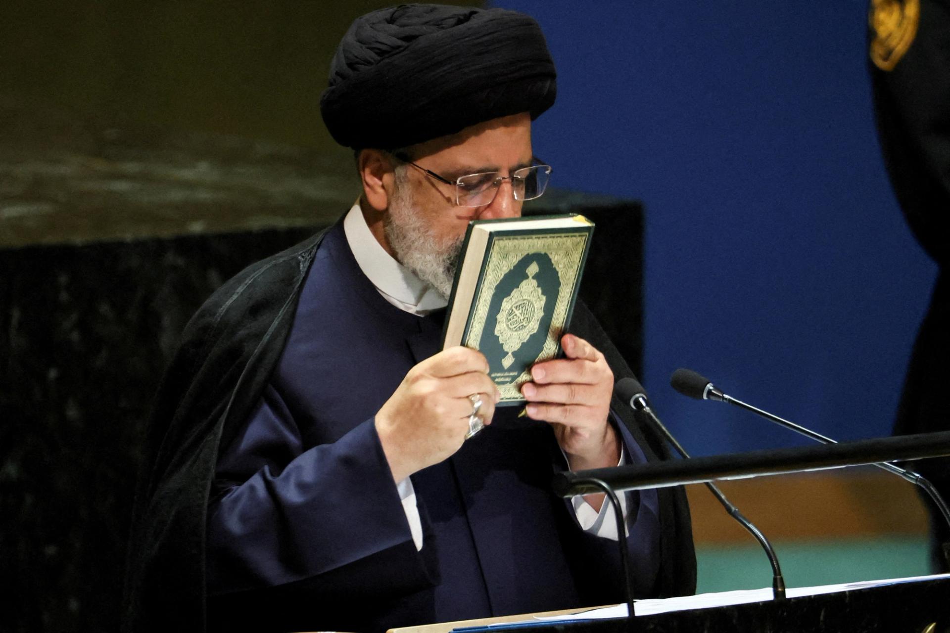 FILE PHOTO: Iran's President Ebrahim Raisi kisses the holy Koran as he addresses the 78th Session of the U.N. General Assembly in New York City, U.S., September 19, 2023. REUTERS/Brendan McDermid/File Photo